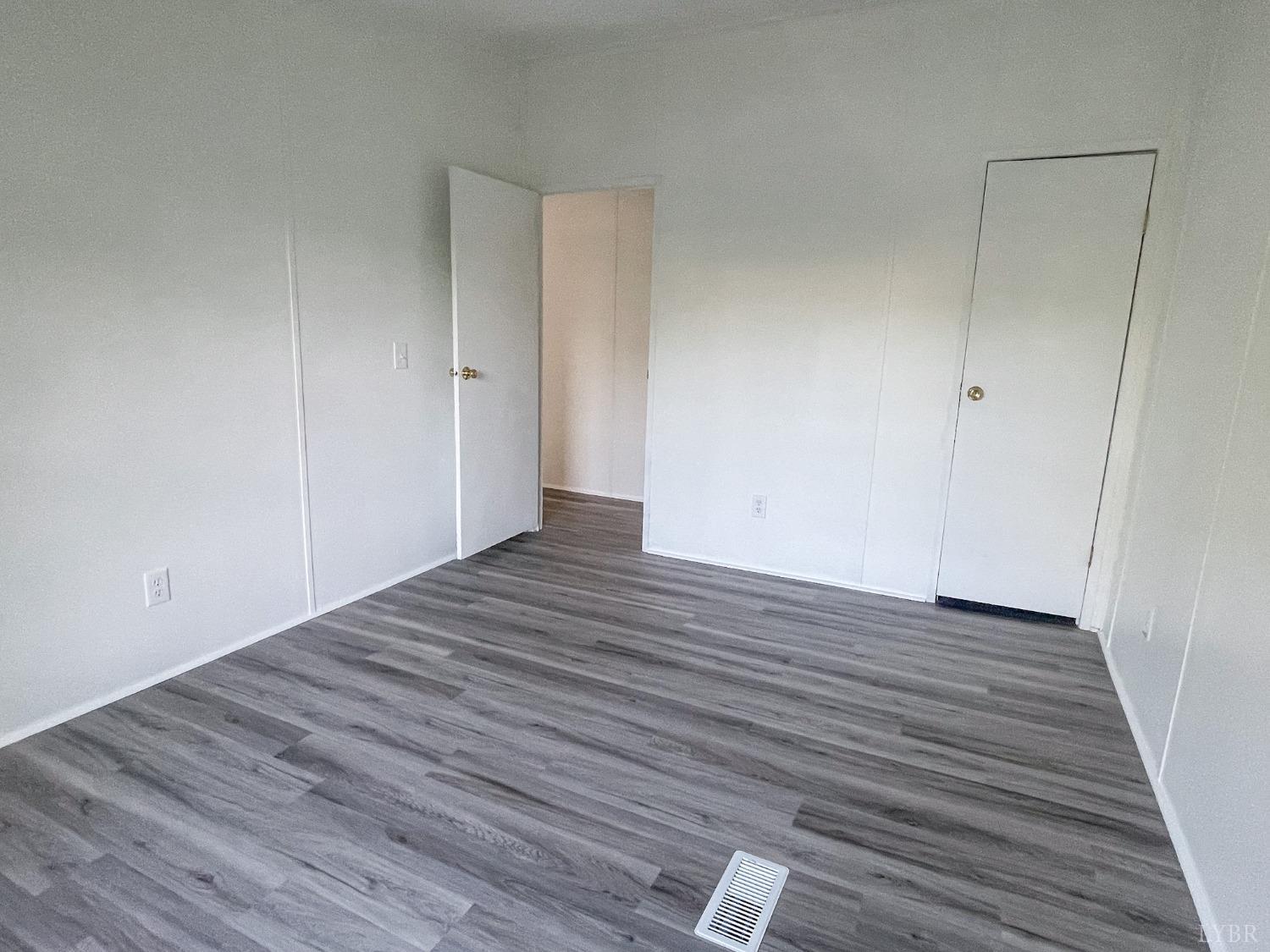 1507 Paradise Road Spout Spring, VA 24538 - Photo 19 of 21 a view of room with wooden floor