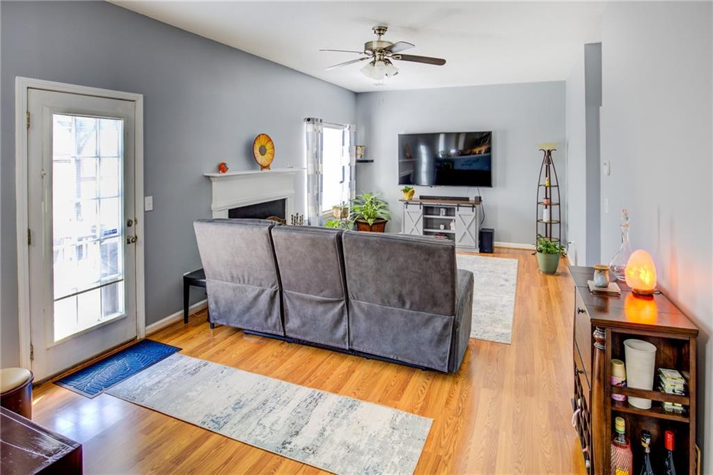 4885 Hidden Creek Place Decatur, GA 30035 - Photo 18 of 52 a living room with furniture and a flat screen tv