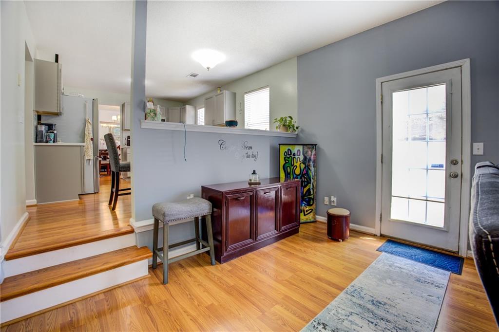 4885 Hidden Creek Place Decatur, GA 30035 - Photo 19 of 52 a living room with furniture and a wooden floor