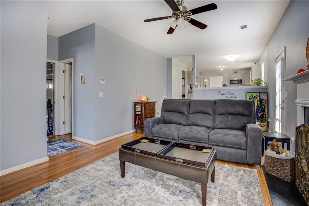 4885 Hidden Creek Place Decatur, GA 30035 - Photo 22 of 52 a living room with furniture and a wooden floor