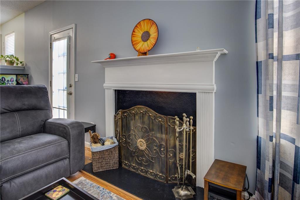 4885 Hidden Creek Place Decatur, GA 30035 - Photo 23 of 52 a living room with furniture and a fireplace