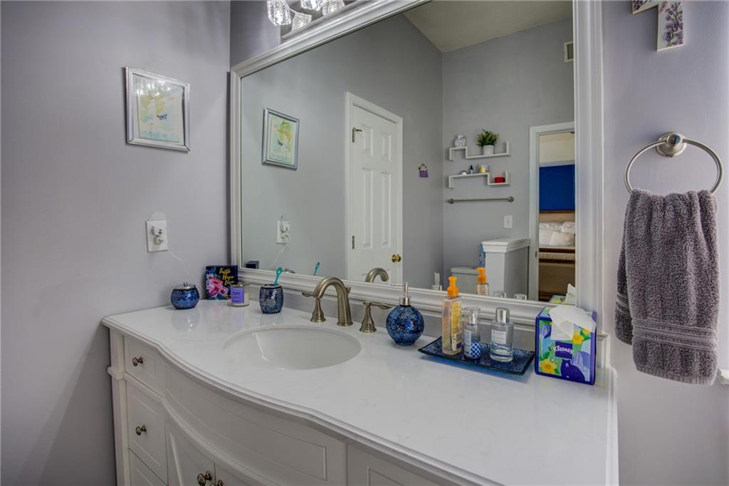 4885 Hidden Creek Place Decatur, GA 30035 - Photo 27 of 52 a bathroom with double vanity sinks a vanity and a mirror
