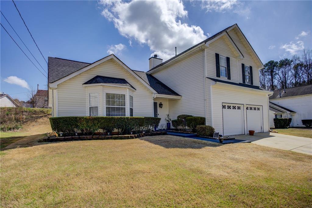 4885 Hidden Creek Place Decatur, GA 30035 - Photo 3 of 52 a front view of a house with a yard