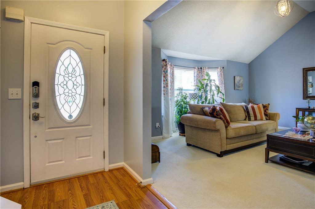 4885 Hidden Creek Place Decatur, GA 30035 - Photo 5 of 52 a living room with furniture and a large window