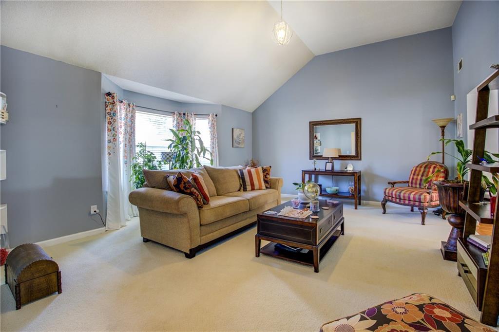 4885 Hidden Creek Place Decatur, GA 30035 - Photo 9 of 52 a living room with furniture a air conditioner vent and a window
