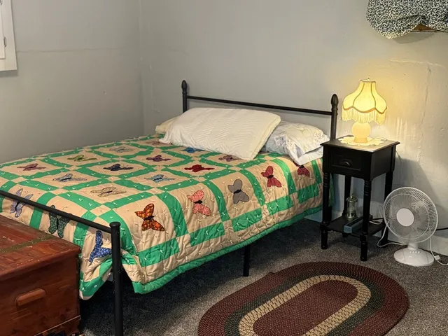 a view of a house with swimming pool and porch with furniture