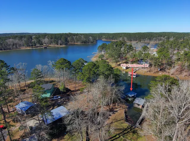 a house with huge green field in front of it