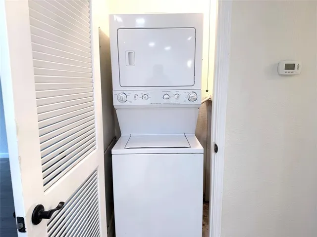 a close view of a utility room with dryer and washer