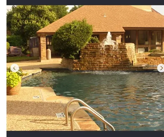 a view of a house with swimming pool