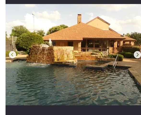 a front view of a house with swimming pool