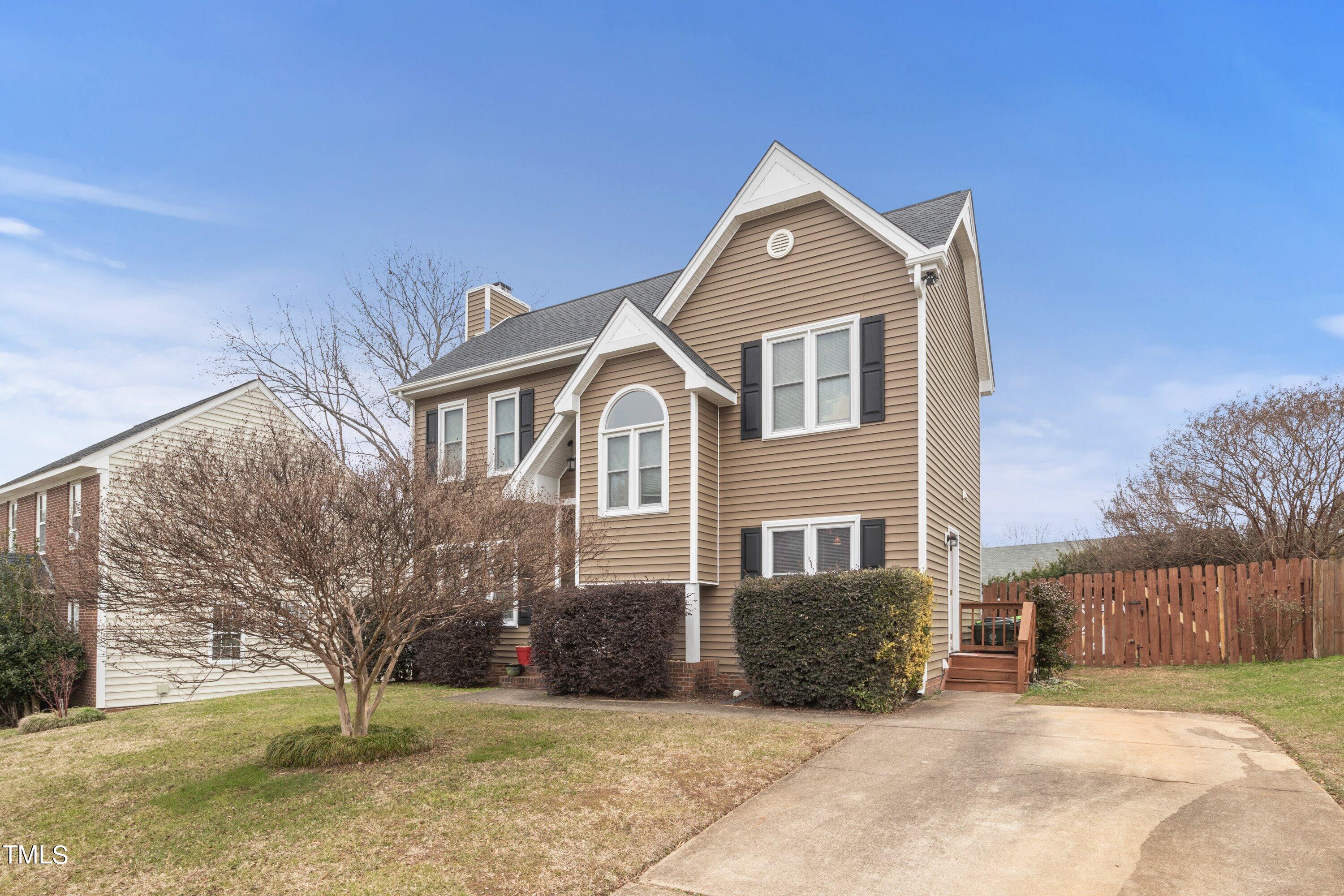 9421 Dawnshire Road Raleigh, NC 27615 - Photo 3 of 32 a front view of a house with a yard