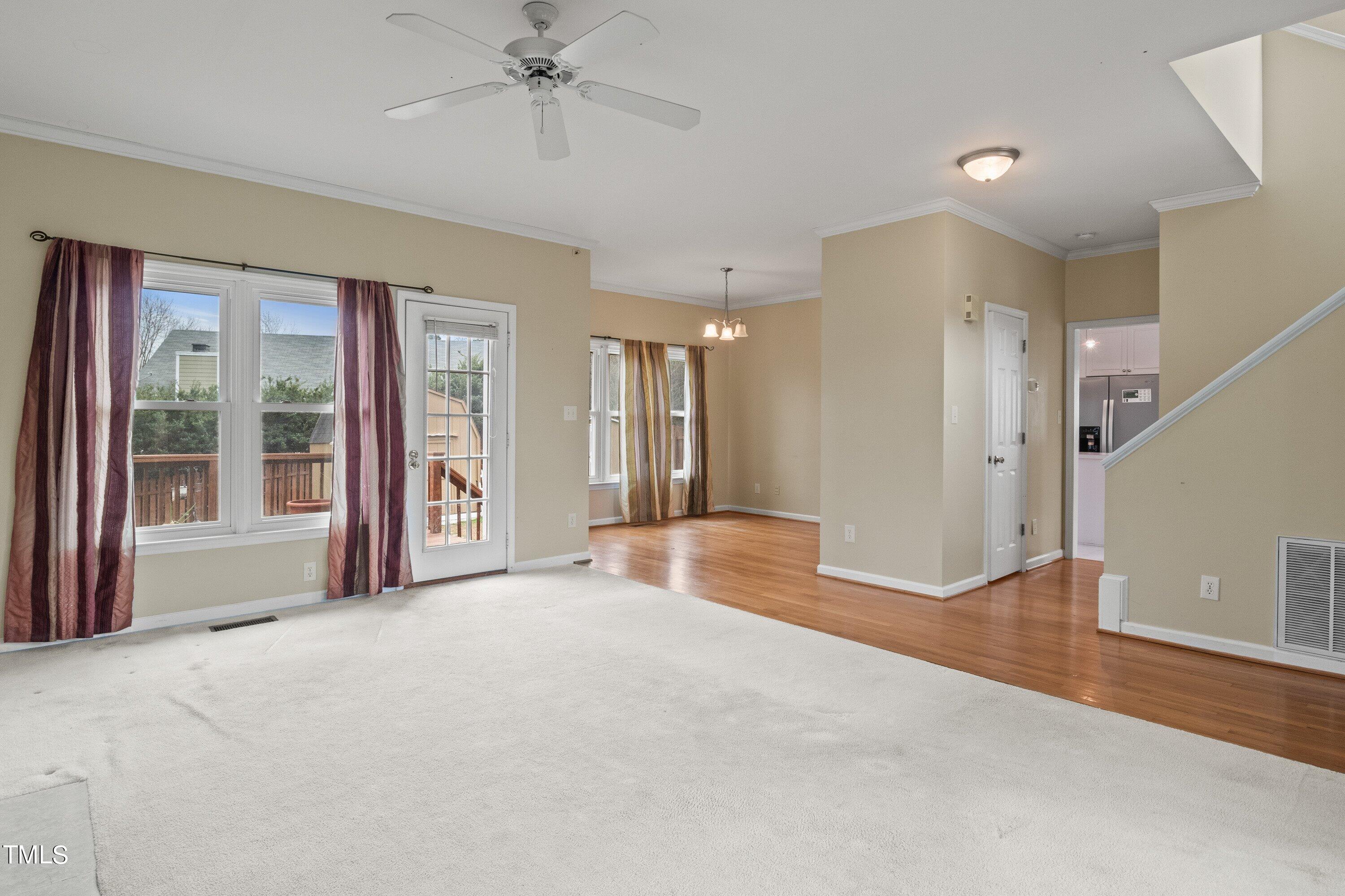 9421 Dawnshire Road Raleigh, NC 27615 - Photo 7 of 32 a view of a livingroom with a staircase