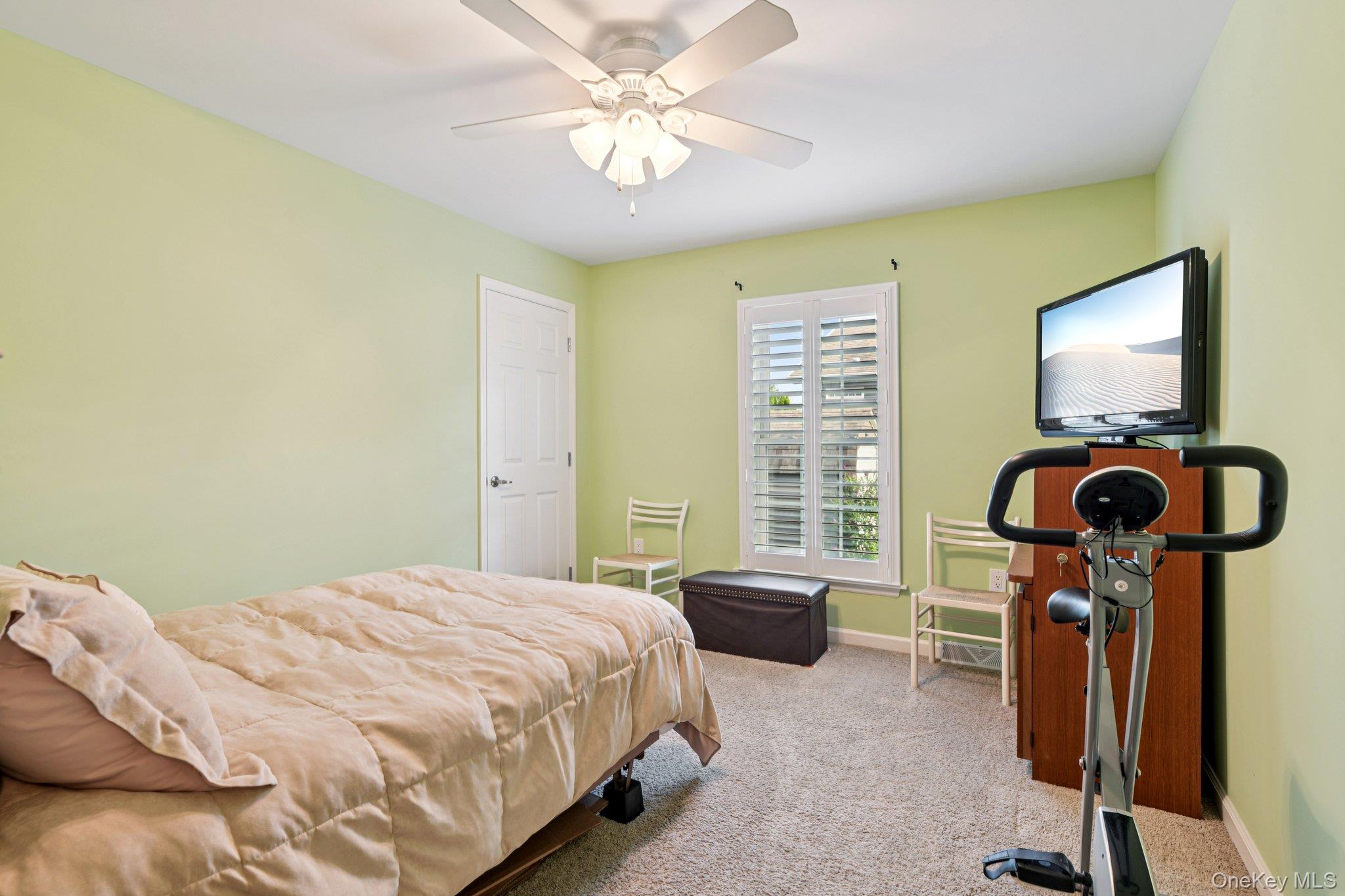 1661 Old Country Road, Unit 543 Riverhead, NY 11901 - Photo 13 of 26 Bedroom with carpet flooring and ceiling fan