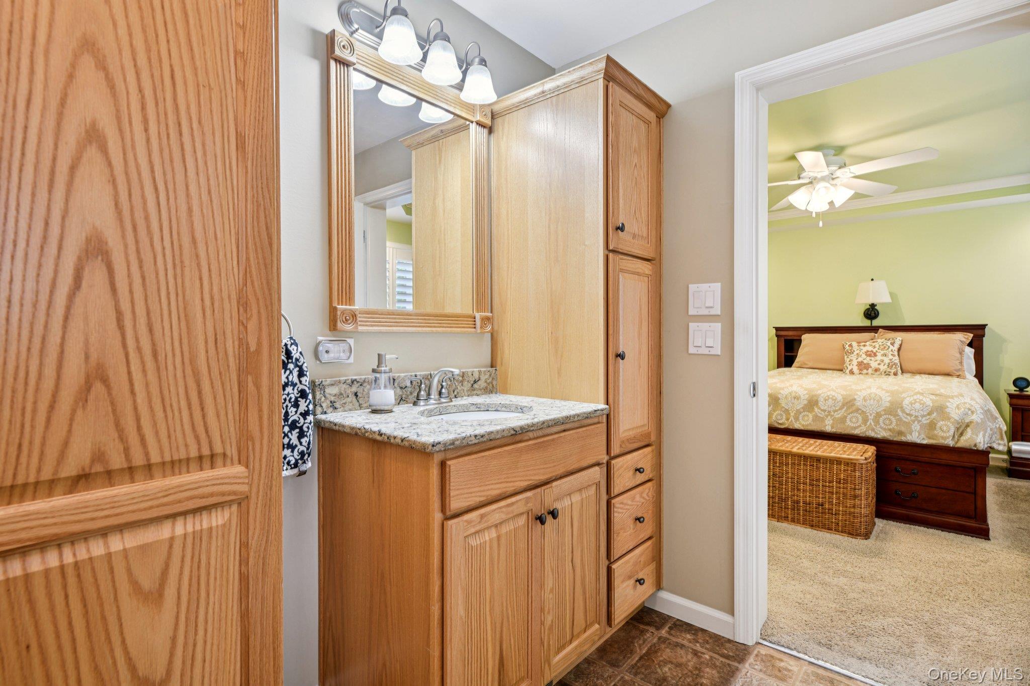 1661 Old Country Road, Unit 543 Riverhead, NY 11901 - Photo 17 of 26 Bathroom featuring vanity and a ceiling fan