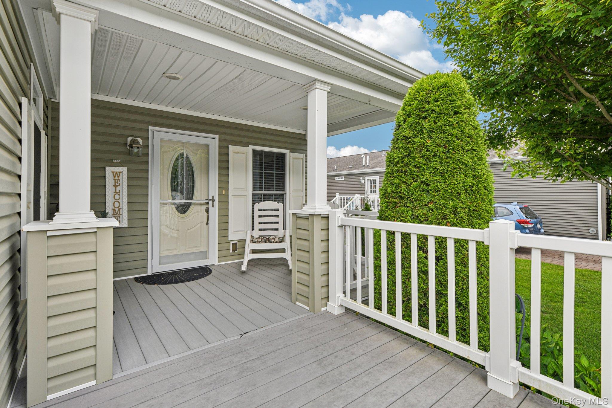 1661 Old Country Road, Unit 543 Riverhead, NY 11901 - Photo 3 of 26 View of wooden porch