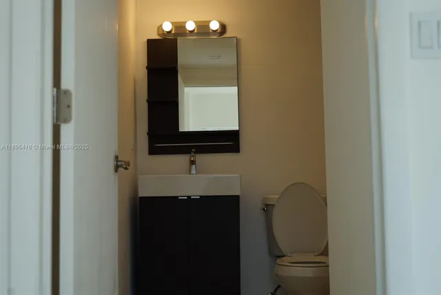 a bathroom with a sink and mirror