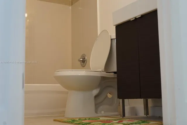 a bathroom with a shower and a sink