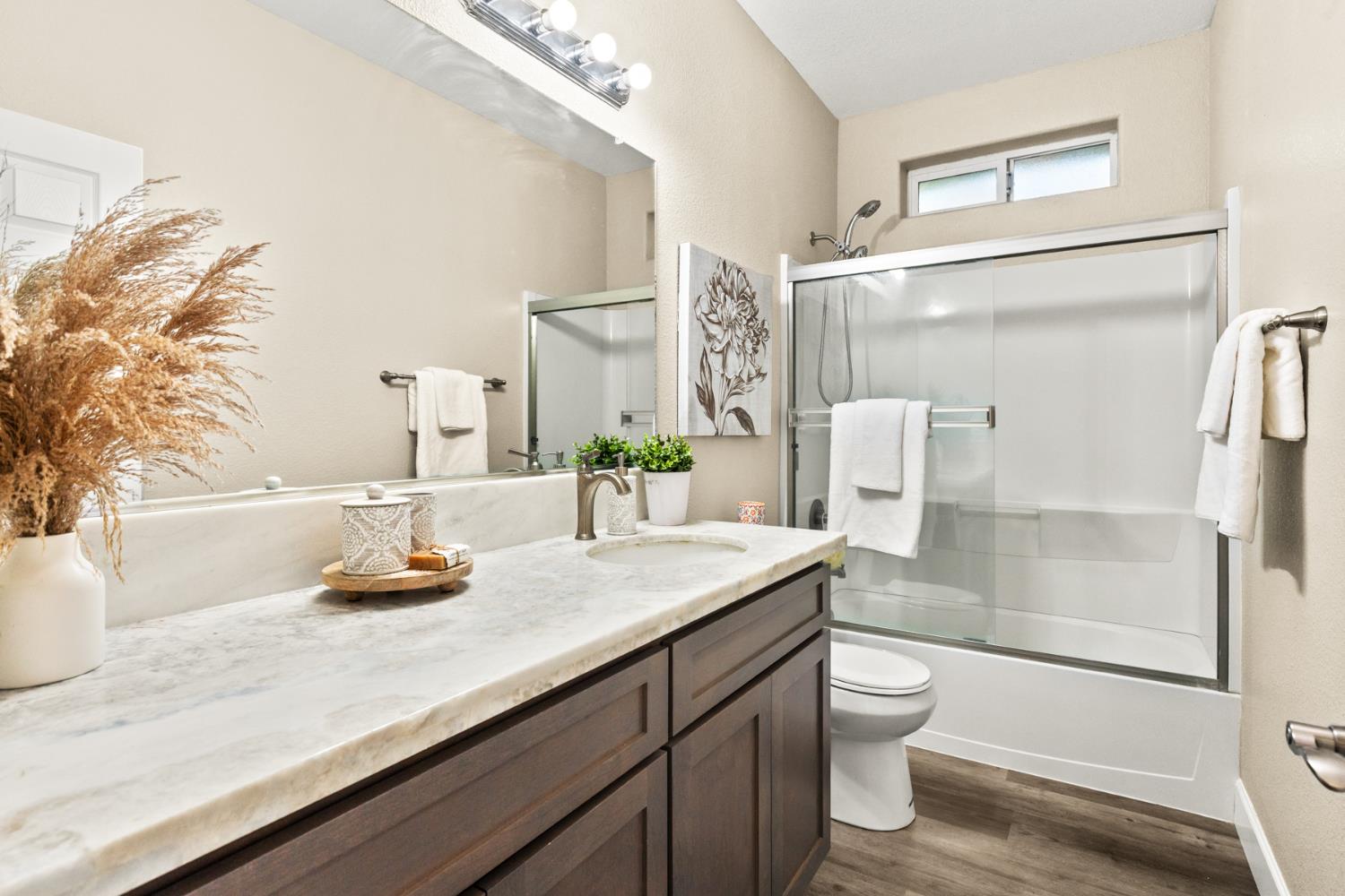 2985 1st Street Biggs, CA 95917 - Photo 11 of 18 a bathroom with a sink a toilet and shower