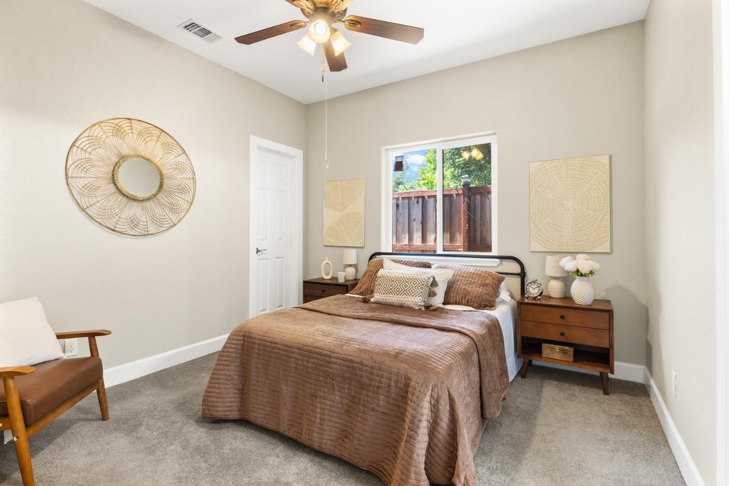 2985 1st Street Biggs, CA 95917 - Photo 12 of 18 a bedroom with a bed and a chandelier
