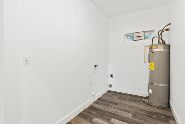 a view of a house with wooden fence