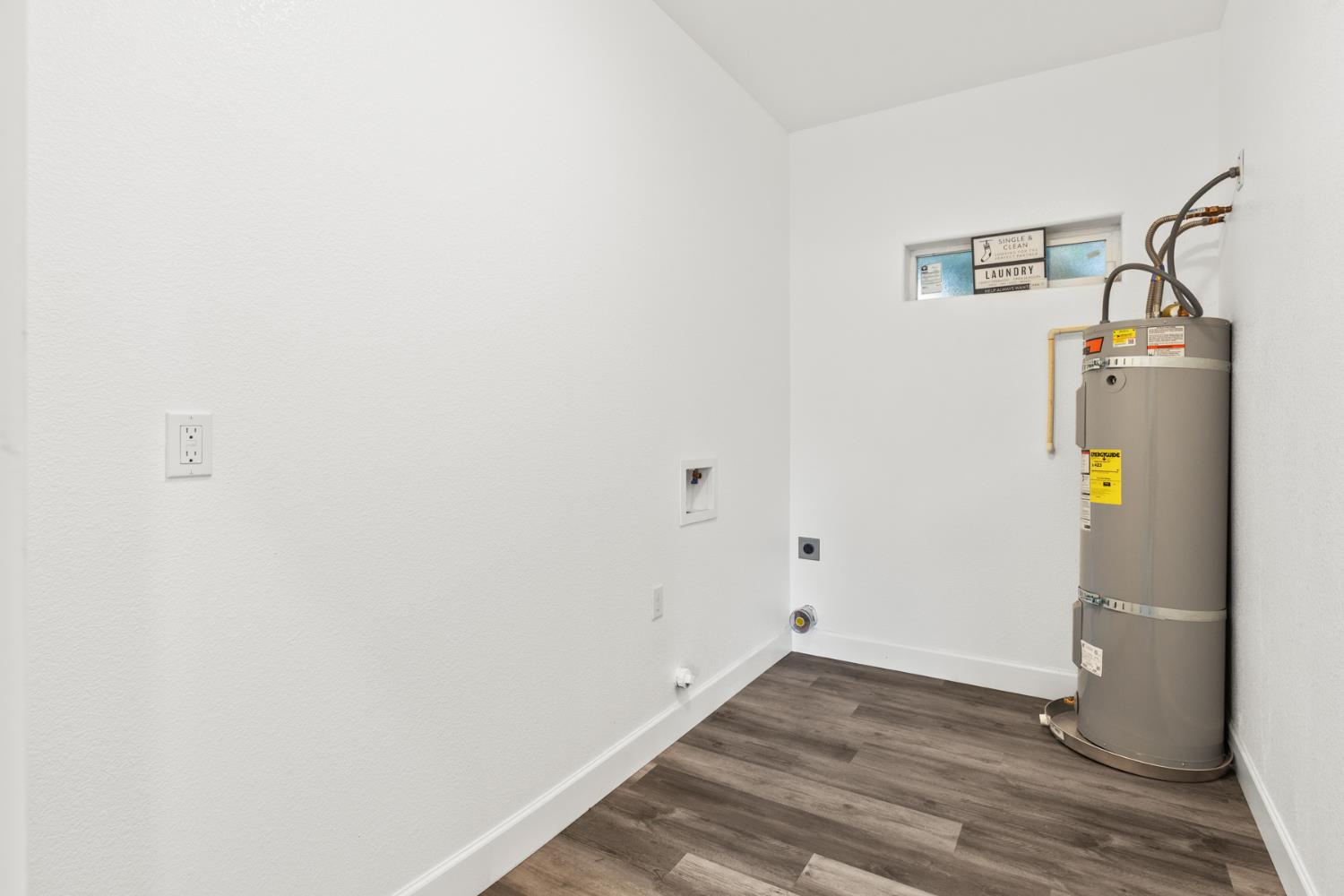 2985 1st Street Biggs, CA 95917 - Photo 14 of 18 a view of storage and utility room with wooden floor