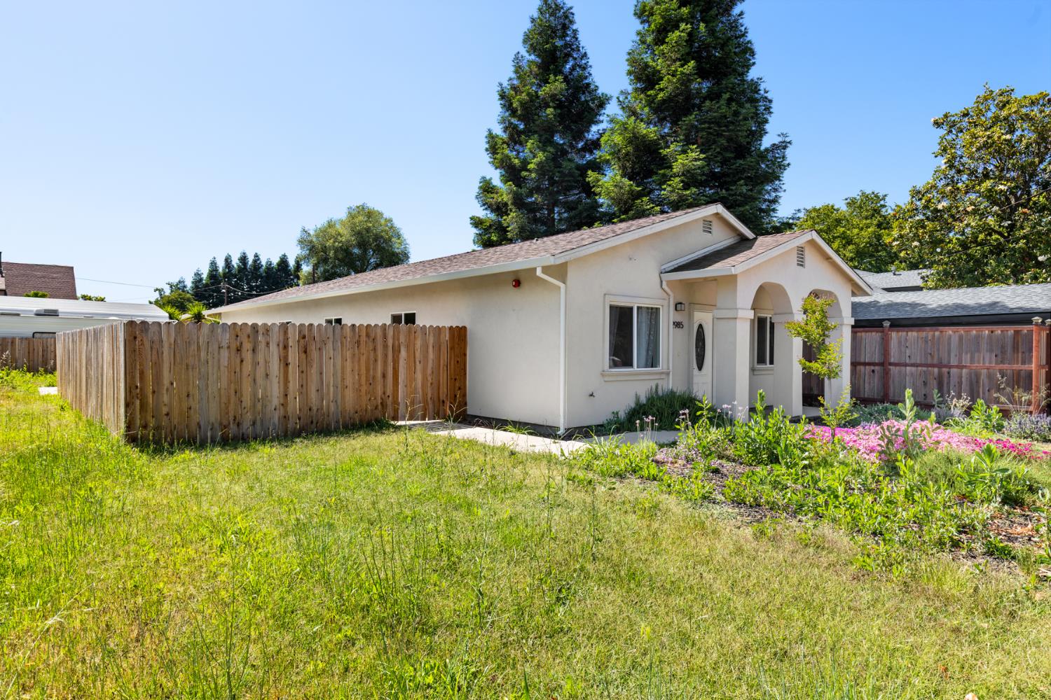 2985 1st Street Biggs, CA 95917 - Photo 15 of 18 a view of a house with wooden fence
