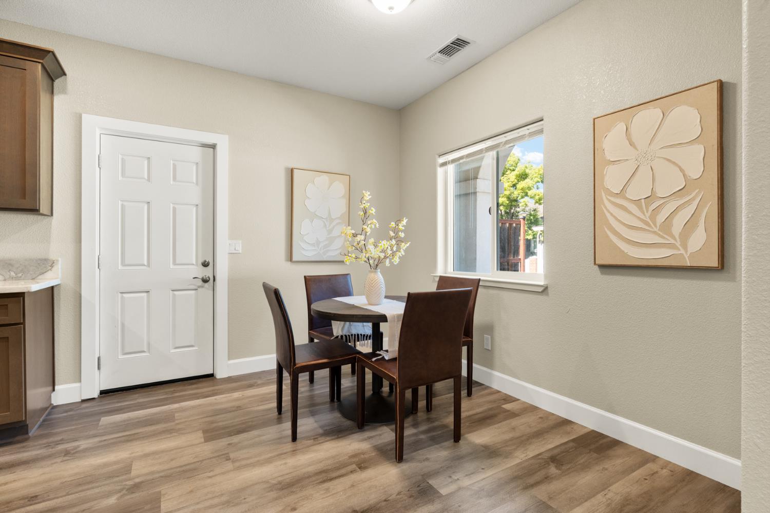 2985 1st Street Biggs, CA 95917 - Photo 5 of 18 a view of a dining room with furniture and a window