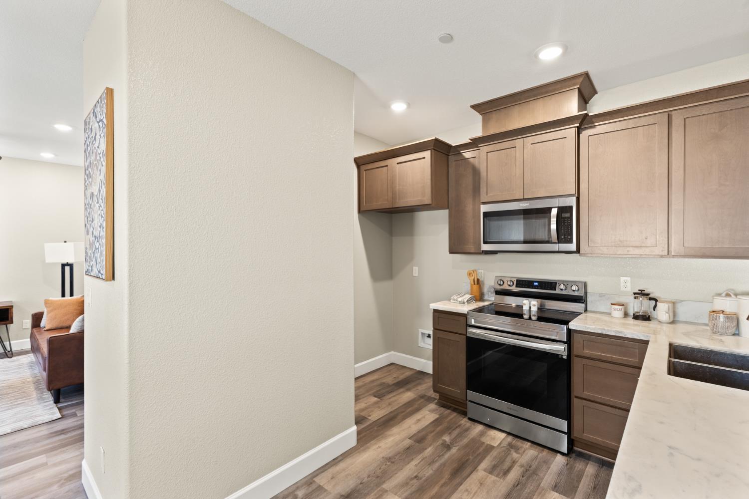 2985 1st Street Biggs, CA 95917 - Photo 7 of 18 a kitchen with stainless steel appliances a stove and a microwave