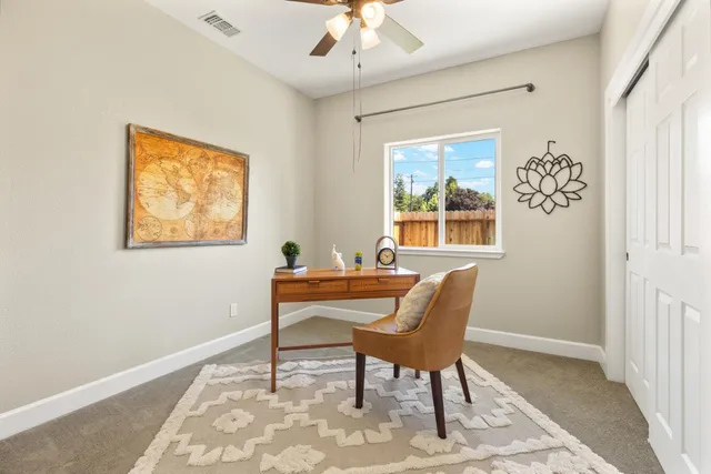 a bedroom with a bed and a couch