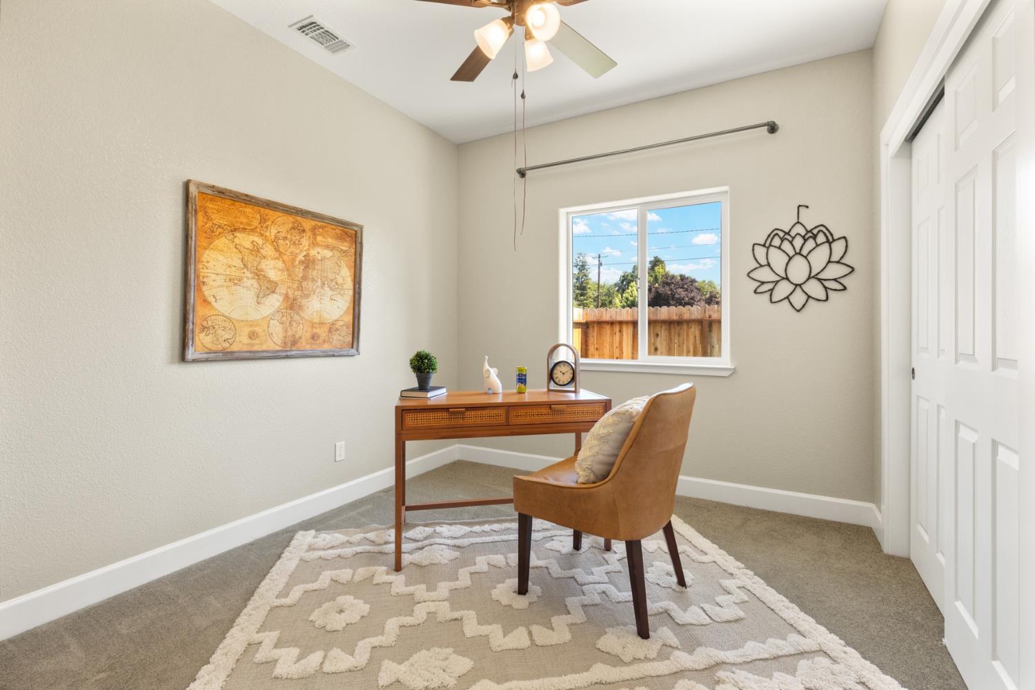 2985 1st Street Biggs, CA 95917 - Photo 8 of 18 a view of a workspace with furniture and a window