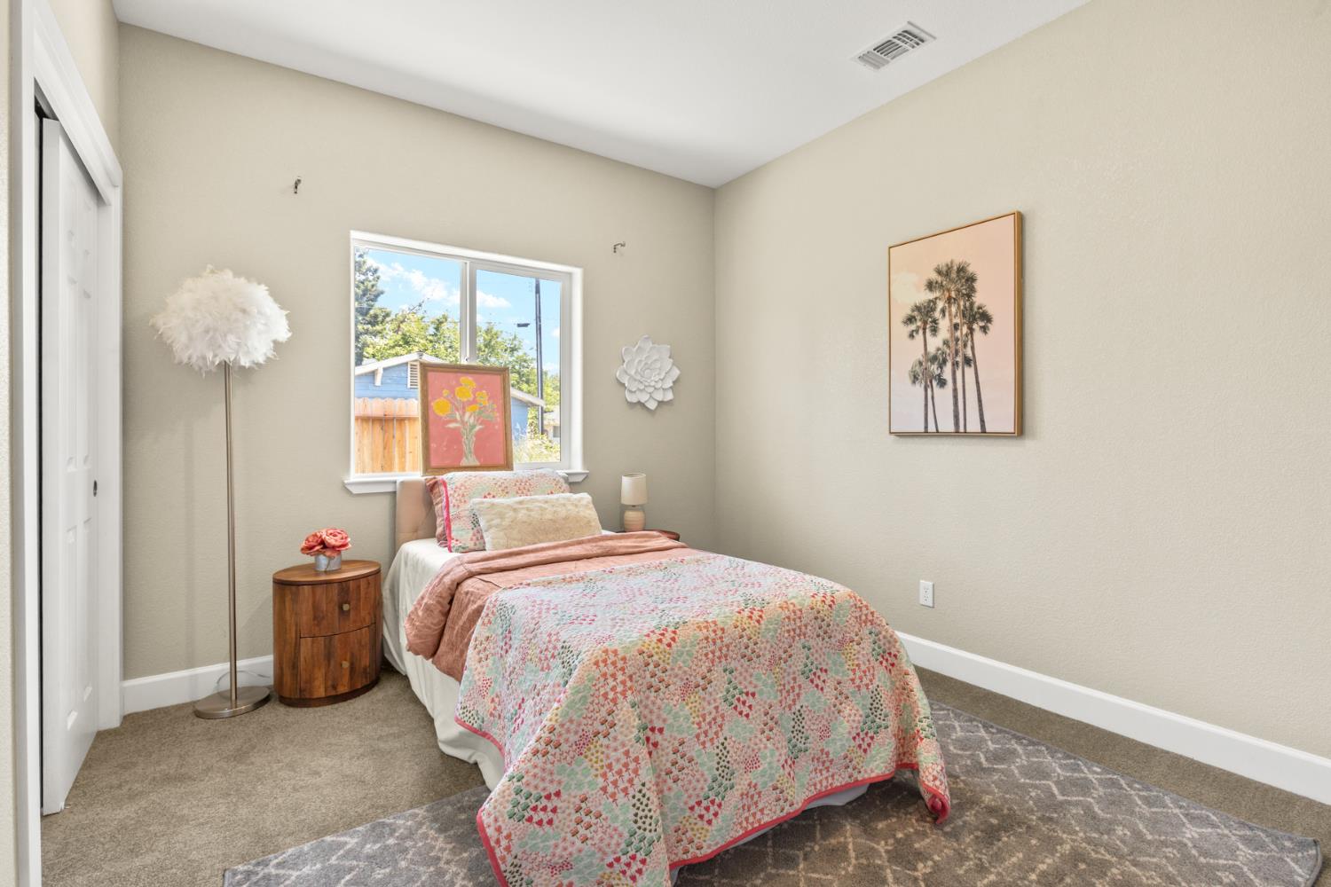 2985 1st Street Biggs, CA 95917 - Photo 10 of 18 a bedroom with a bed and a window