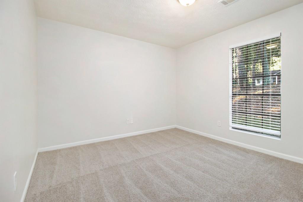 5774 Taffeta Court Lithonia, GA 30058 - Photo 16 of 25 a view of an empty room with a window