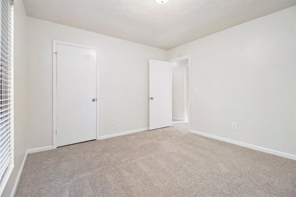 5774 Taffeta Court Lithonia, GA 30058 - Photo 17 of 25 a view of an empty room