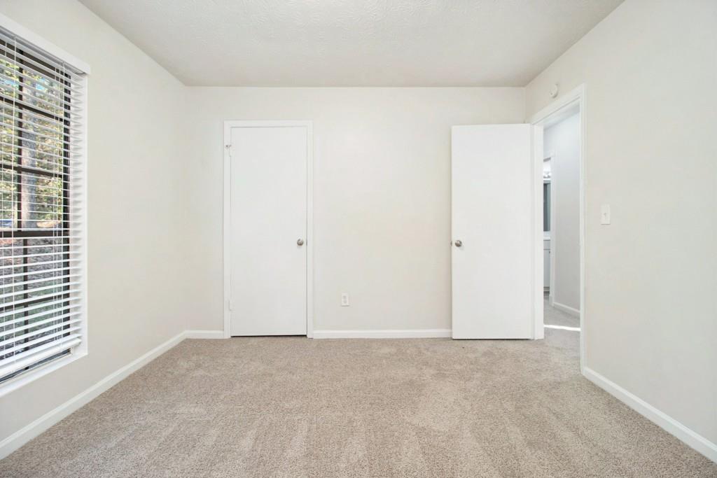 5774 Taffeta Court Lithonia, GA 30058 - Photo 18 of 25 a view of an empty room
