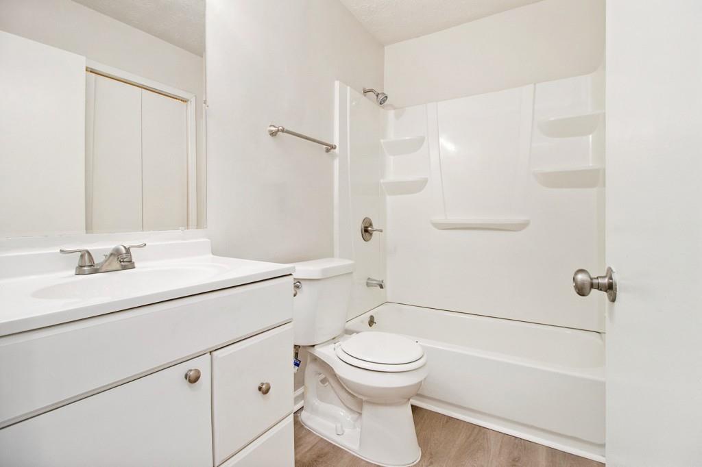 5774 Taffeta Court Lithonia, GA 30058 - Photo 19 of 25 a bathroom with a sink a toilet and shower
