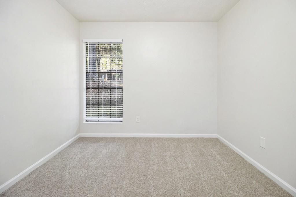 5774 Taffeta Court Lithonia, GA 30058 - Photo 21 of 25 a view of an empty room with a window