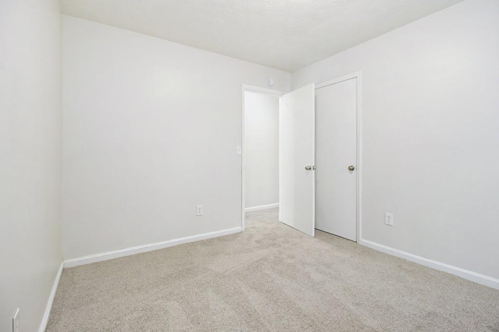 5774 Taffeta Court Lithonia, GA 30058 - Photo 22 of 25 a view of an empty room