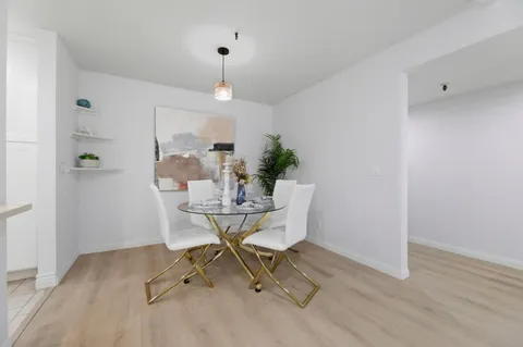 a workspace room with furniture and wooden floor