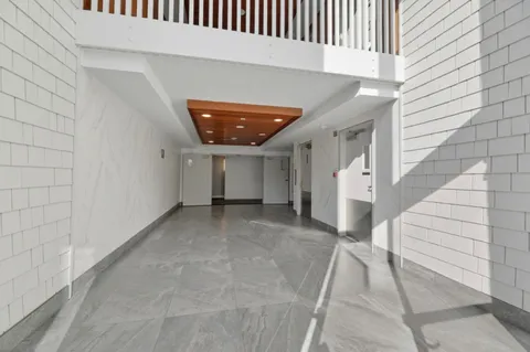 a pathway of a house with a yard