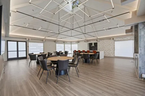 a view of a house with a yard and sitting area