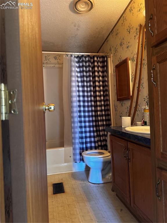 4150 Sengbeil Road Yoder, CO 80864 - Photo 6 of 9 a bathroom with a sink toilet and shower
