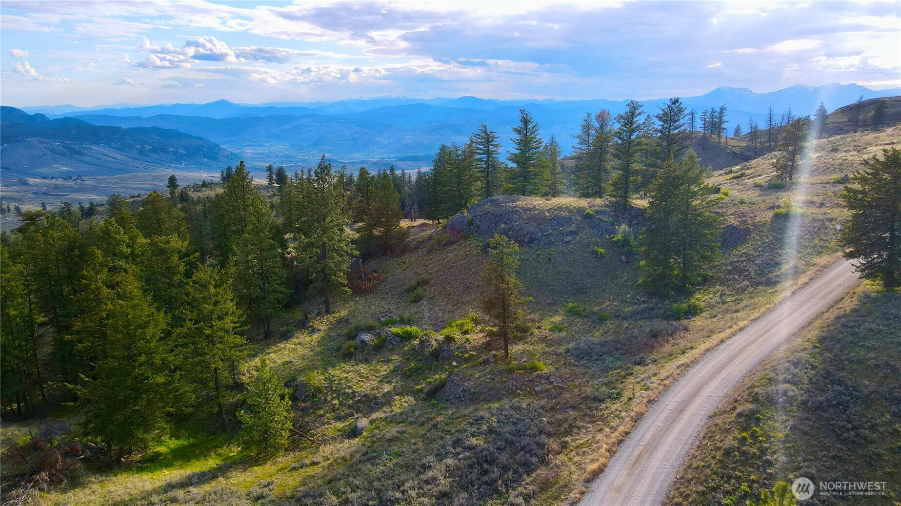 -tbd Blue Grouse Road Oroville, WA 98844 - Photo 24 of 31 a view of a yard with mountains in the background