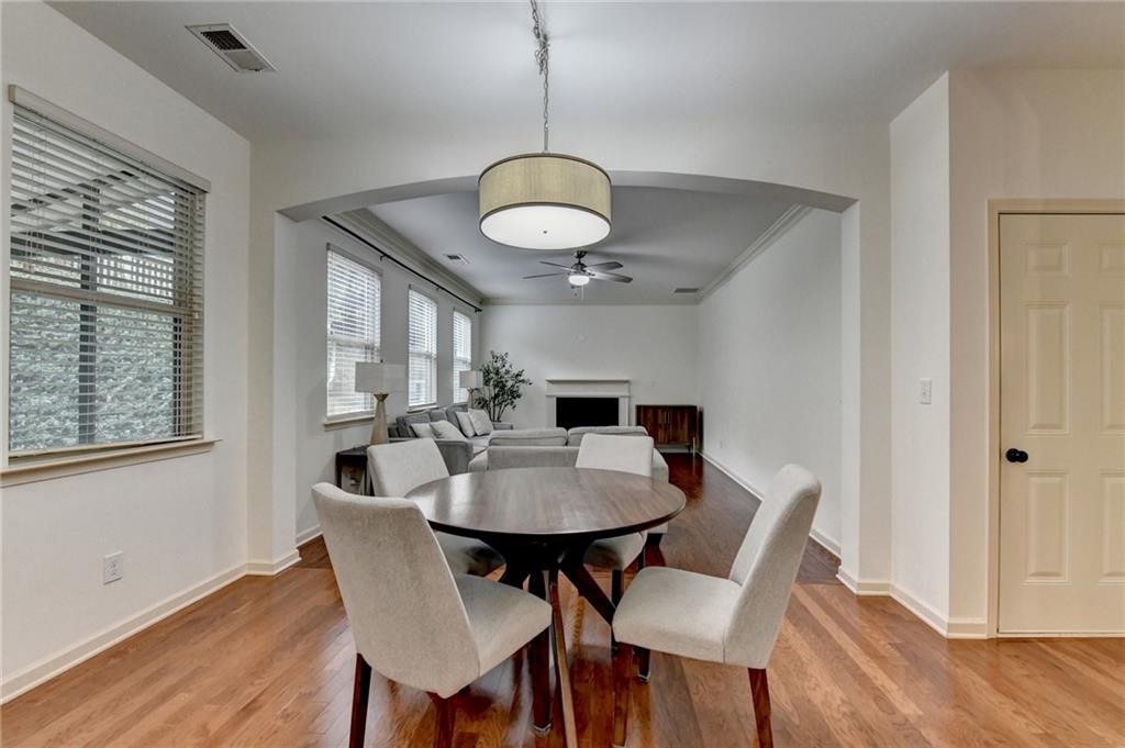 5013 Groover Drive Smyrna, GA 30080 - Photo 14 of 70 a view of a dining room with furniture and wooden floor