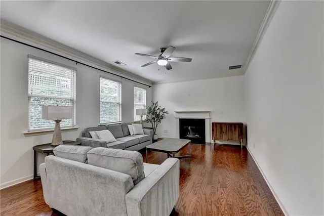 a view of a dining room with furniture wooden floor and chandelier