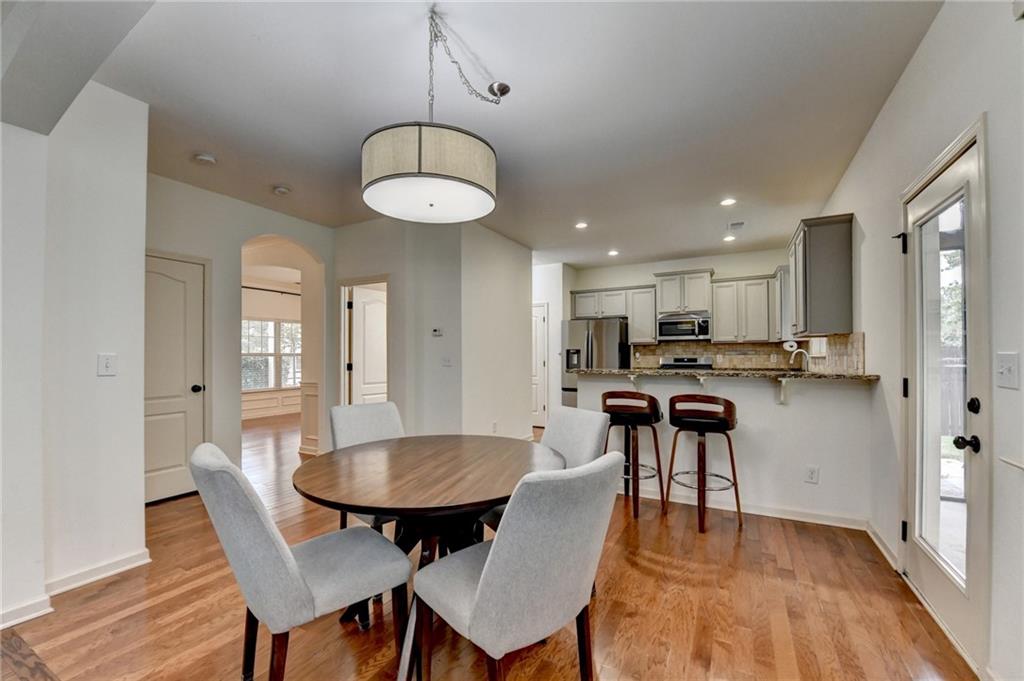 5013 Groover Drive Smyrna, GA 30080 - Photo 34 of 70 a view of a dining room with furniture wooden floor and chandelier