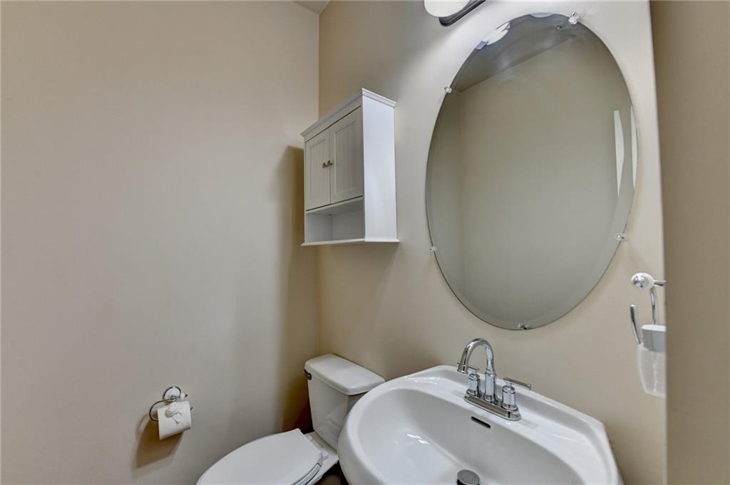 5013 Groover Drive Smyrna, GA 30080 - Photo 35 of 70 a bathroom with a sink mirror and toilet
