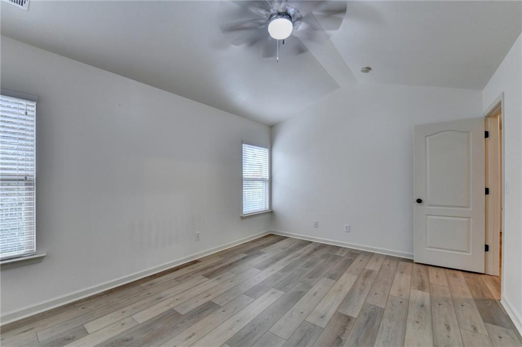 5013 Groover Drive Smyrna, GA 30080 - Photo 38 of 70 an empty room with wooden floor and windows