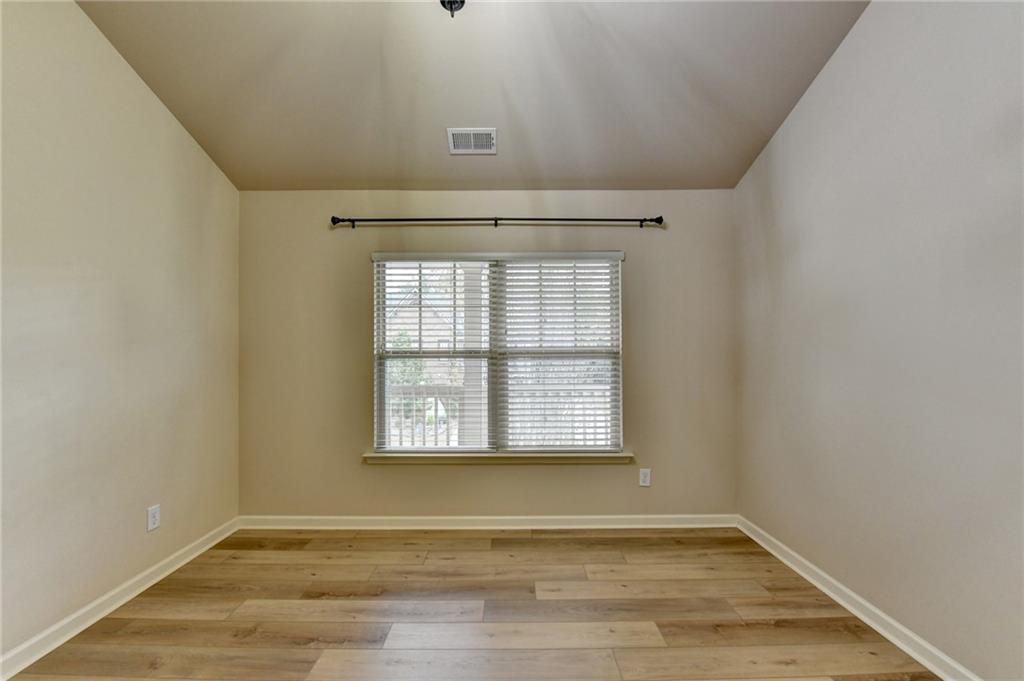 5013 Groover Drive Smyrna, GA 30080 - Photo 42 of 70 an empty room with wooden floor and windows
