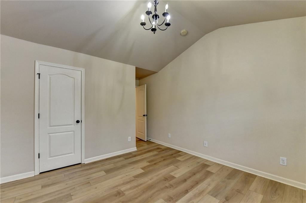 5013 Groover Drive Smyrna, GA 30080 - Photo 43 of 70 a view of an empty room with wooden floor