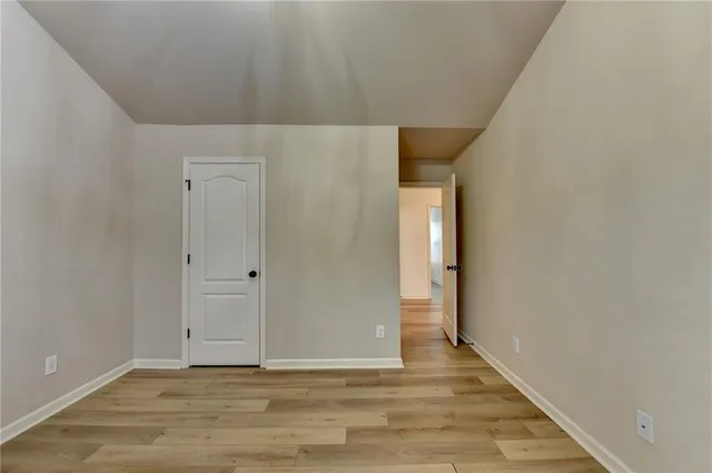 a view of balcony with wooden floor